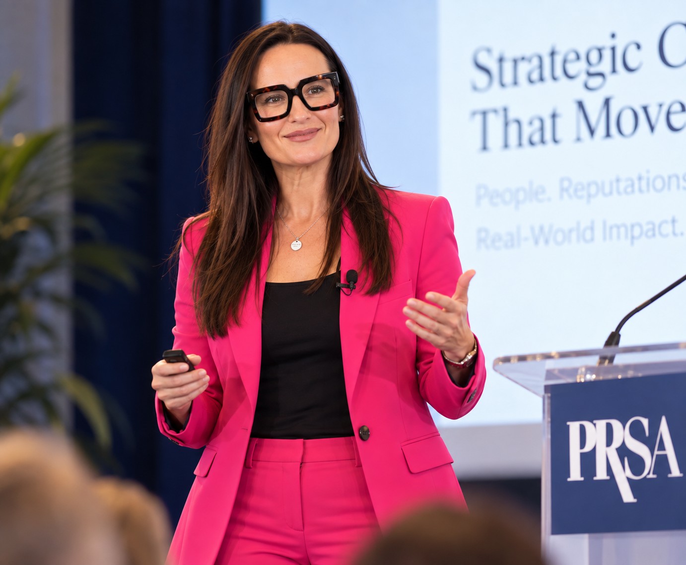 Leigh Fazzina speaking on stage about strategic communications